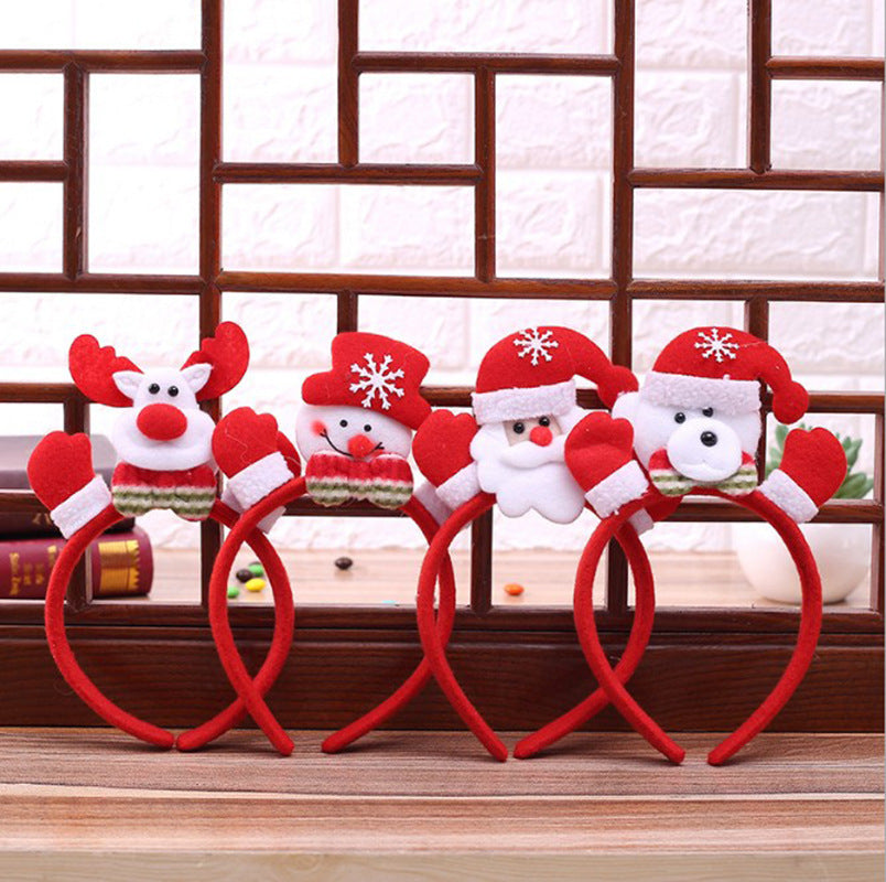 Four festive red headbands with plush holiday characters: a reindeer, a snowman, Santa, and a bear, each wearing red and white hats with snowflake patterns.