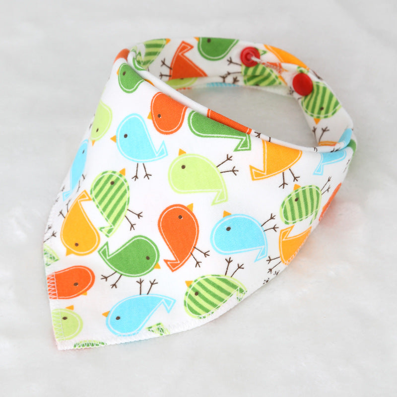 Colorful bib with cartoon birds in blue, green, orange, and yellow on white fabric. The bib has a triangular shape with snap closure.