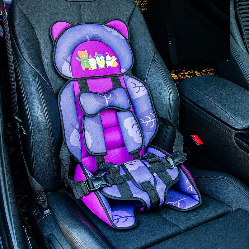 Purple child safety seat with cartoon animals, featuring cushioning and harnesses, is installed in a car's black leather seat.