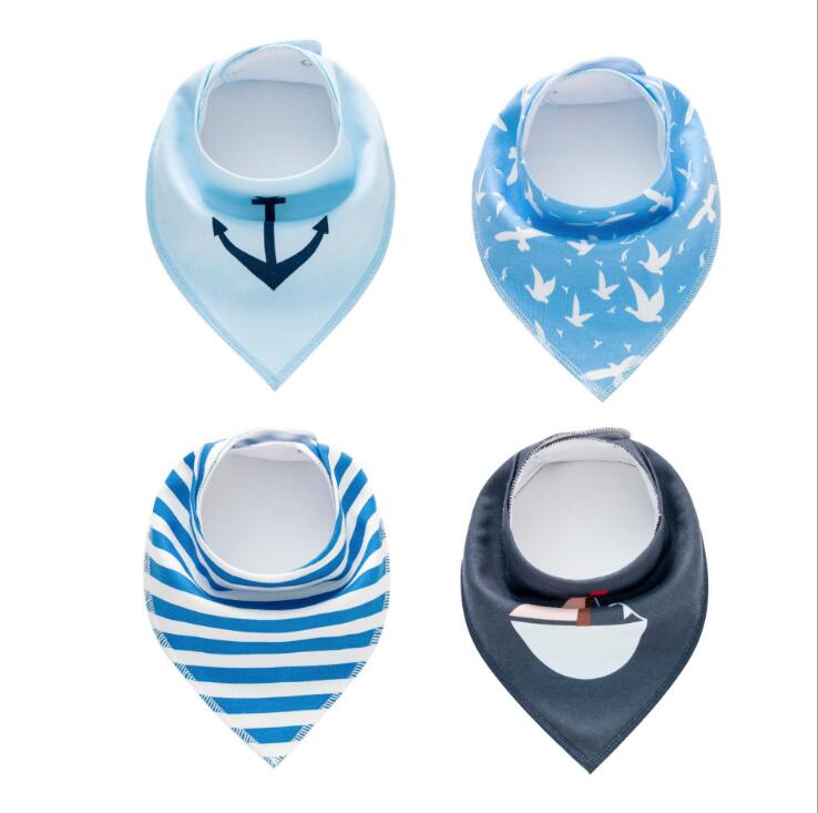 Four baby bandana bibs: light blue with anchor, blue with white birds, blue and white stripes, and dark blue with a boat design.