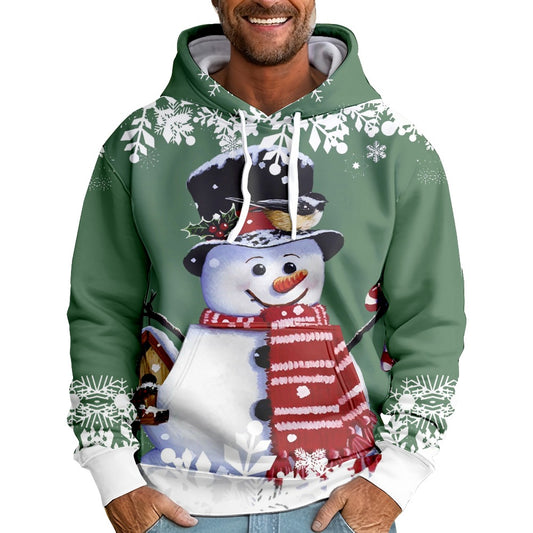 A man wears a festive green hoodie with a cheerful snowman, wearing a red scarf and top hat, printed on the front. Snowflakes adorn the edges, adding a wintry touch.