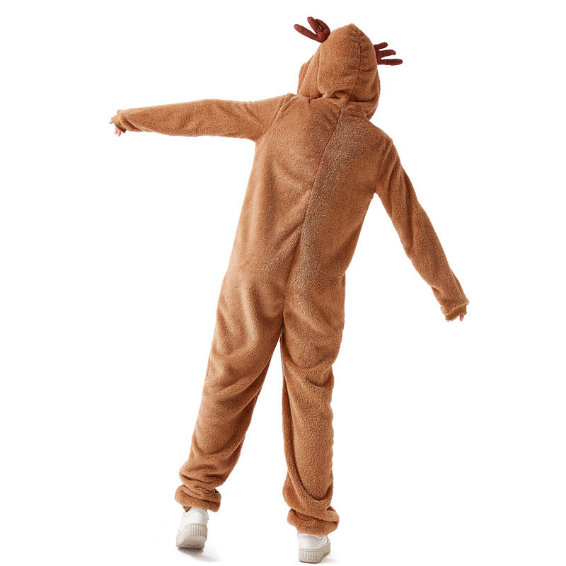 Person in a brown reindeer onesie with antlers on the hood, facing away, arms outstretched. The outfit is cozy, covering the body fully, with white shoes visible.