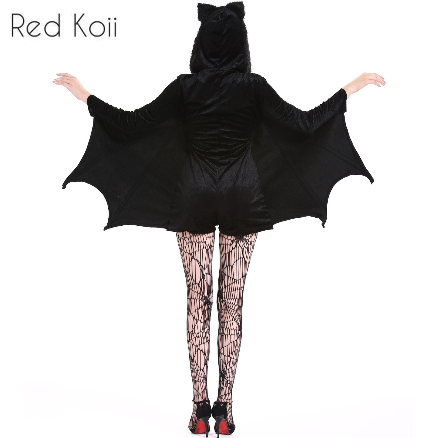 A person wearing a black bat costume with wings and hood. The outfit includes spiderweb-patterned tights and high heels. Arms are extended to display the wings.