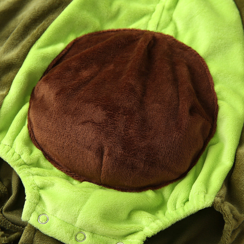 Close-up of a plush green fabric with a large round brown patch in the center, resembling the texture of a soft costume or stuffed toy with snap buttons at the bottom.