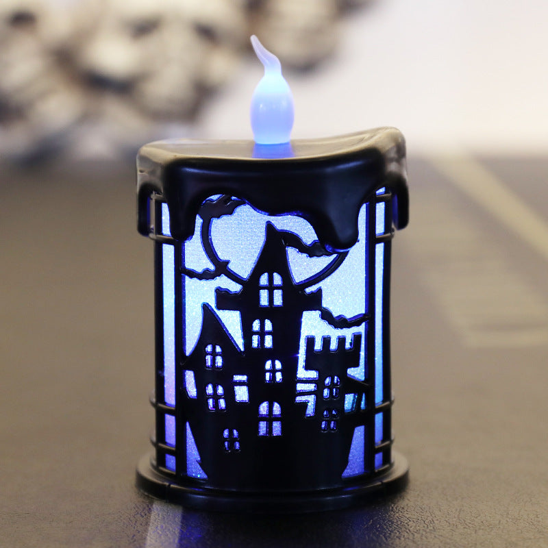 A small black lantern with a silhouette of a haunted castle, surrounded by trees, with a glowing blue background. The top resembles dripping wax, and a white flame-shaped light extends from the center, creating a spooky ambiance.
