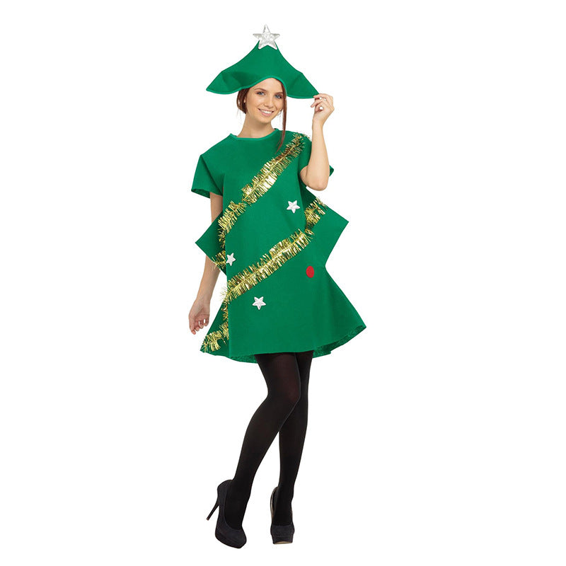 Person in a Christmas tree costume with stars and tinsel, wearing black tights and heels, holding a matching hat with a silver star on top, smiling at the camera.