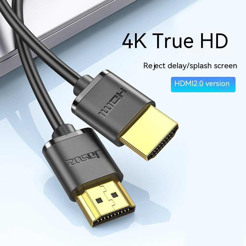 HDMI cables for 4K True HD with text promoting rejection of delay and splash screens. Labeled as HDMI 2.0 version with close-up on connectors and a laptop in the background.