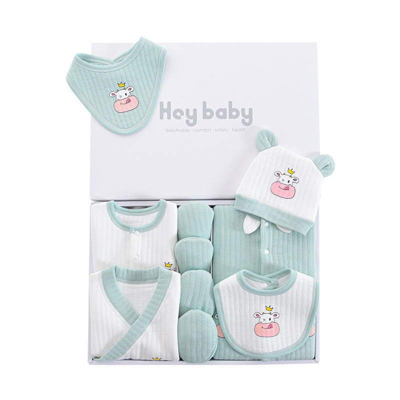 Boxed baby gift set in mint green and white, featuring a bib, hat with ears, mittens, and onesies. All items are adorned with a cute hippo design wearing a crown.