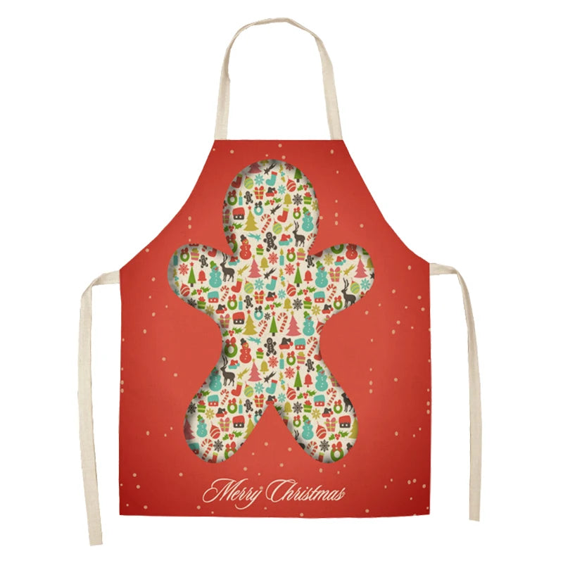 Red Christmas apron featuring a gingerbread man shape filled with festive icons like snowmen, trees, and gifts. "Merry Christmas" text at the bottom.