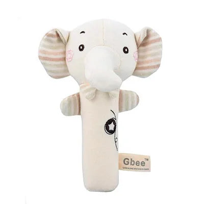 Soft, beige elephant plush toy with striped ears and a long trunk. The elephant features blush cheeks and embroidered details, with a tag labeled "Gbee."
