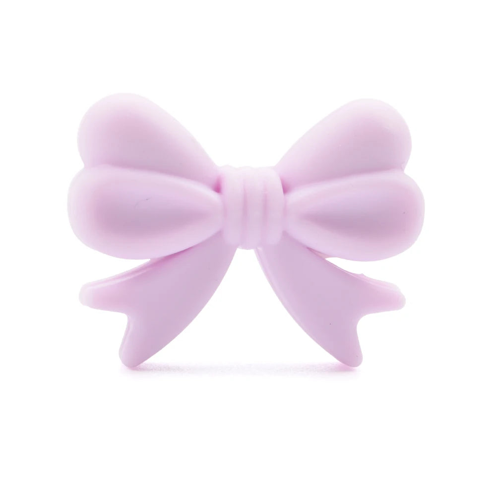 Light purple, heart-shaped bow with a soft texture and symmetrical loops.