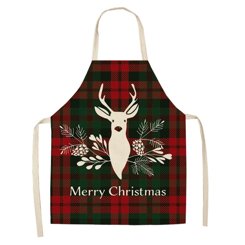 Red and green plaid apron featuring a white reindeer, pinecones, and branches. The text "Merry Christmas" is displayed below the reindeer design.