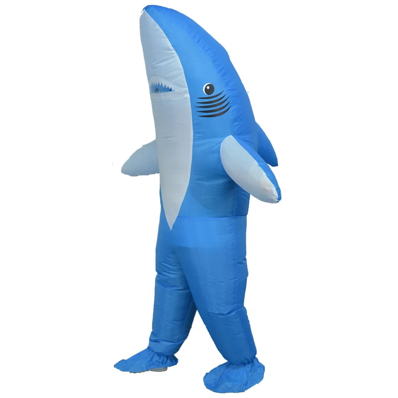 Inflatable blue shark costume standing upright with fins extended, featuring a cartoonish face and detailed gills, set against a plain white background.
