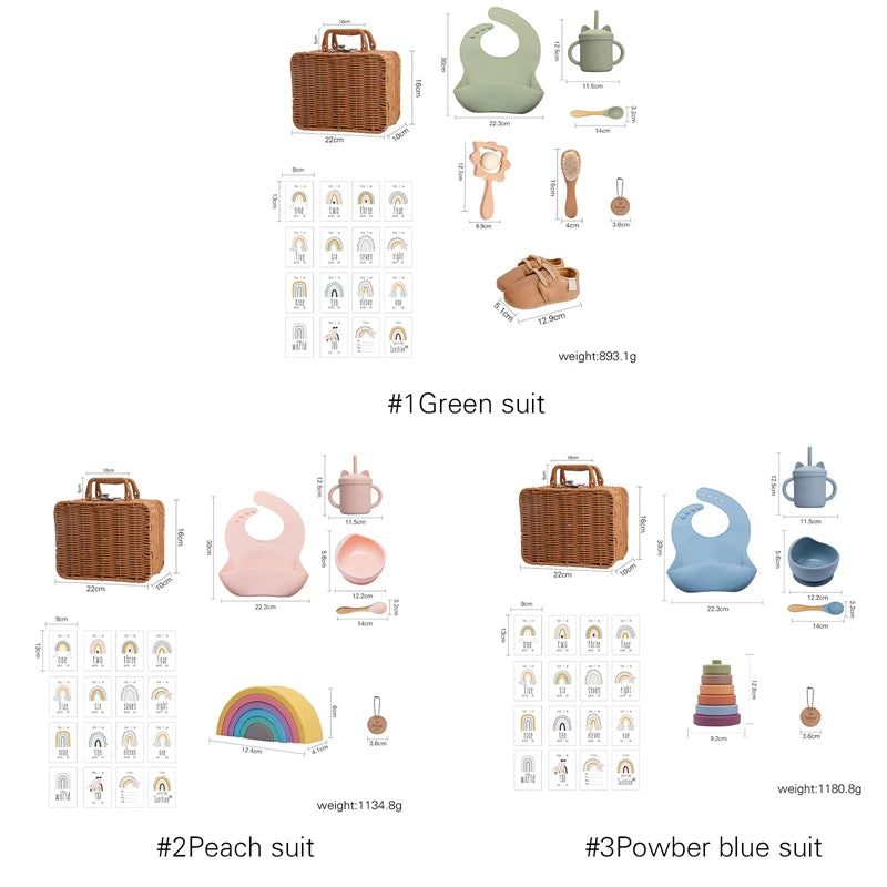 Three baby gift sets are displayed: Green, Peach, and Blue. Each set includes a wicker basket, bib, sippy cup, bowl, utensils, plus extras like toys or shoes.