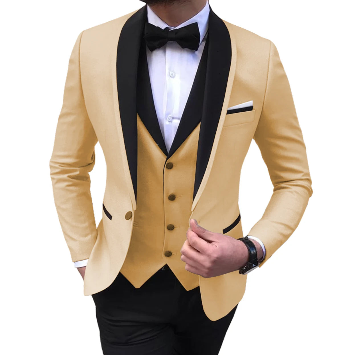 Man wearing a stylish, light tan tuxedo jacket with black lapels, a matching tan vest, a white shirt, and a black bow tie. He is adjusting the jacket.