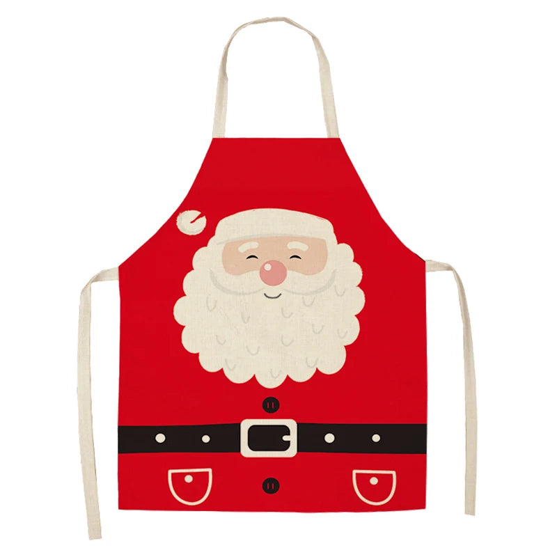 Red apron with a Santa Claus design, featuring a white beard, smiling face, red nose, and black belt. Beige straps are attached at the neck and sides.