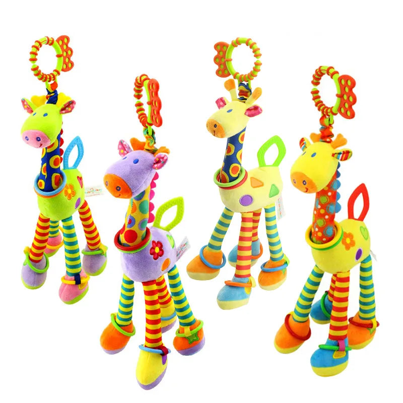 Four colorful plush giraffe toys with striped legs and patterns in circles and triangles. Each has a clip-on ring at the top, designed for attachment to strollers or cribs.