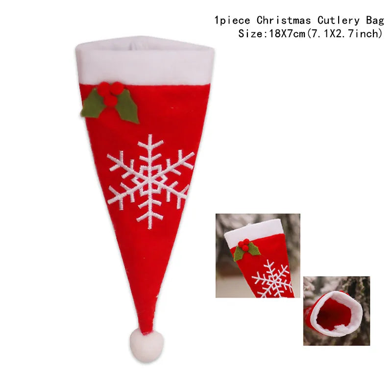Red Santa hat-shaped Christmas cutlery bag with white trim and pom-pom, featuring a white snowflake design and green holly with red berries. Measures 18x7 cm.