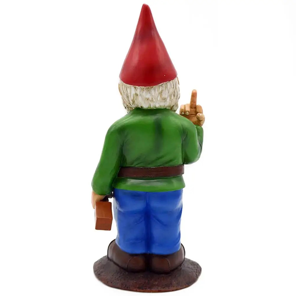 A garden gnome with a red hat and green jacket stands on a brown base, holding a small box in one hand, while cheekily raising a middle finger with the other hand.