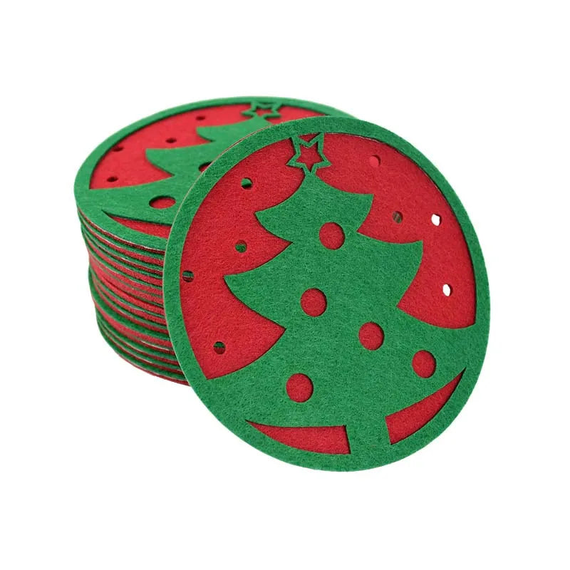Stack of round felt coasters with cut-out green Christmas tree design on a red background.