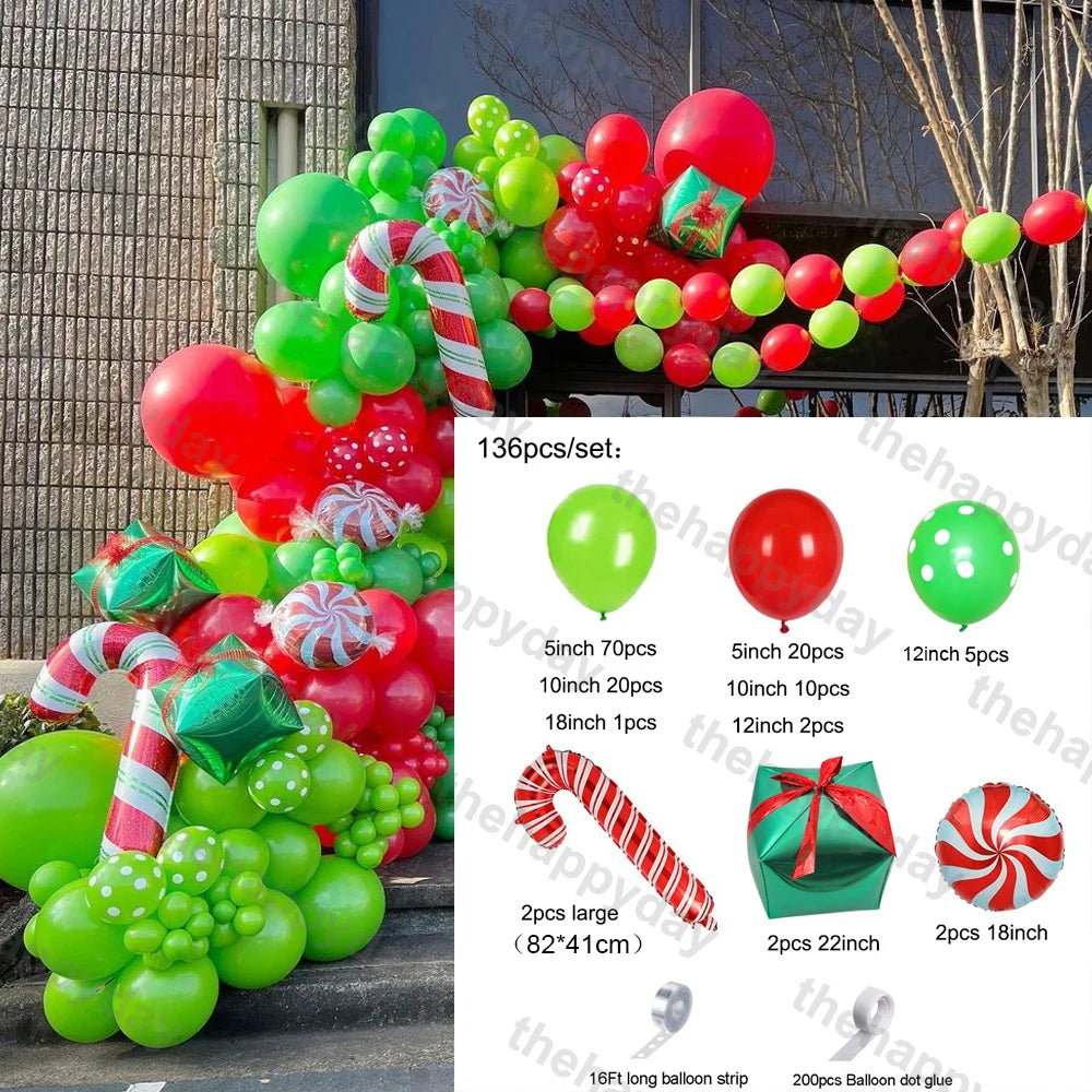 Festive balloon arch with red and green balloons, candy cane shapes, and gift box designs. A set includes 136 pieces, featuring various balloon sizes and decor items.