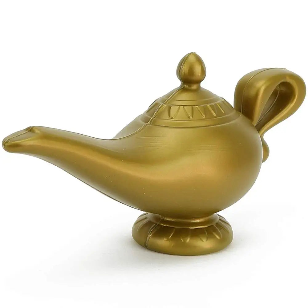 A golden oil lamp with a curved spout, round body, and ornate handle, sitting on a decorative base, resembling a classic genie lamp.