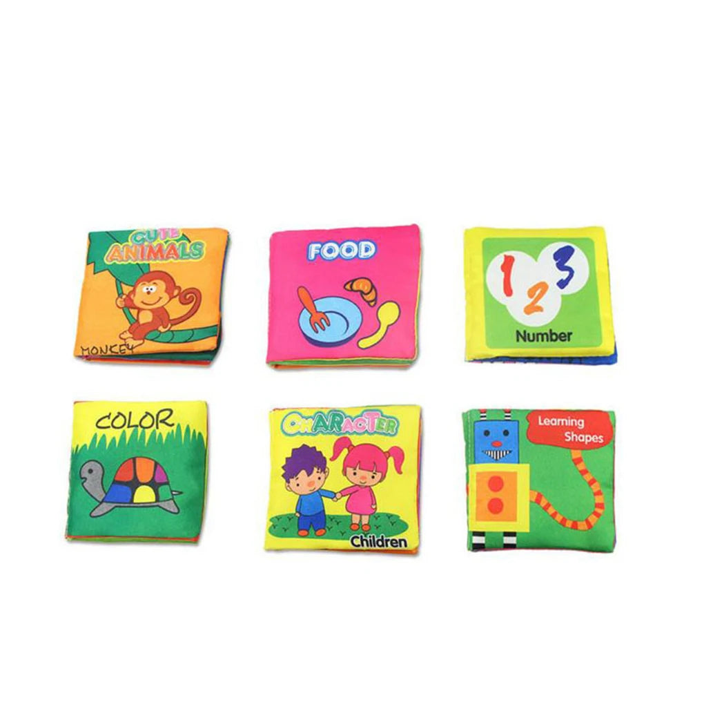 Six colorful children's cloth books featuring themes like animals, food, numbers, colors, characters, and shapes. Each cover has playful illustrations.