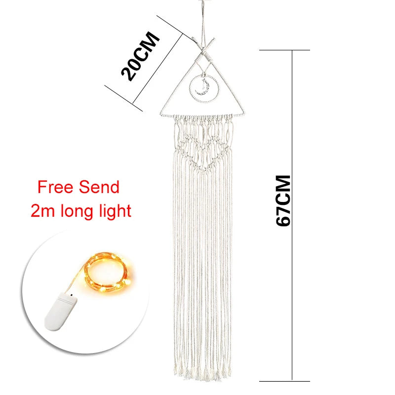 Triangle-shaped macrame wall hanging, 20cm wide by 67cm long, with fringe and heart design. Includes a free 2m LED light string with USB plug.