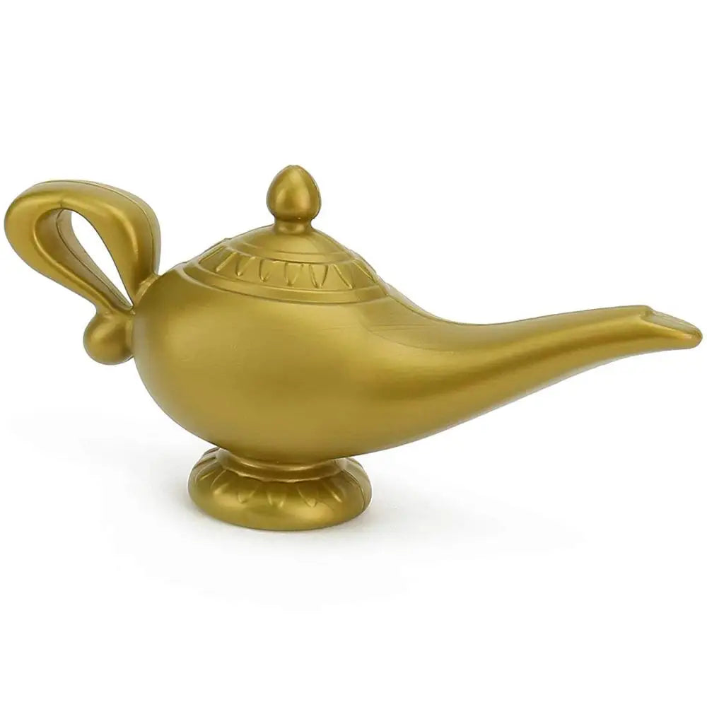 A golden, ornate oil lamp with a curved handle and pointed spout, resting on a decorative base, resembling a traditional magical lamp from folklore.