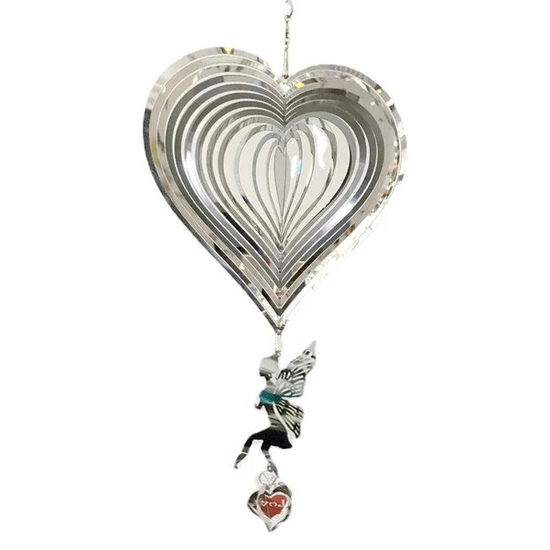 Silver heart-shaped wind spinner with a layered design, featuring a dangling silhouette of a fairy and a small heart charm inscribed with "Love."