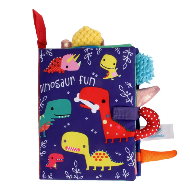 Colorful children's soft book titled "Dinosaur Fun" with cartoon dinosaurs on a purple cover, featuring various textures and colorful fabric tabs sticking out.