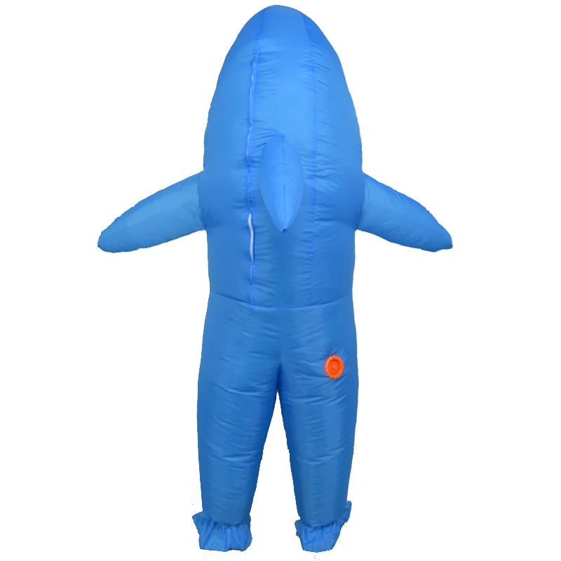 Inflatable blue shark costume seen from the back, showing fins, an orange valve, and a tail. The material is shiny, with defined seams and slightly puffed shapes.