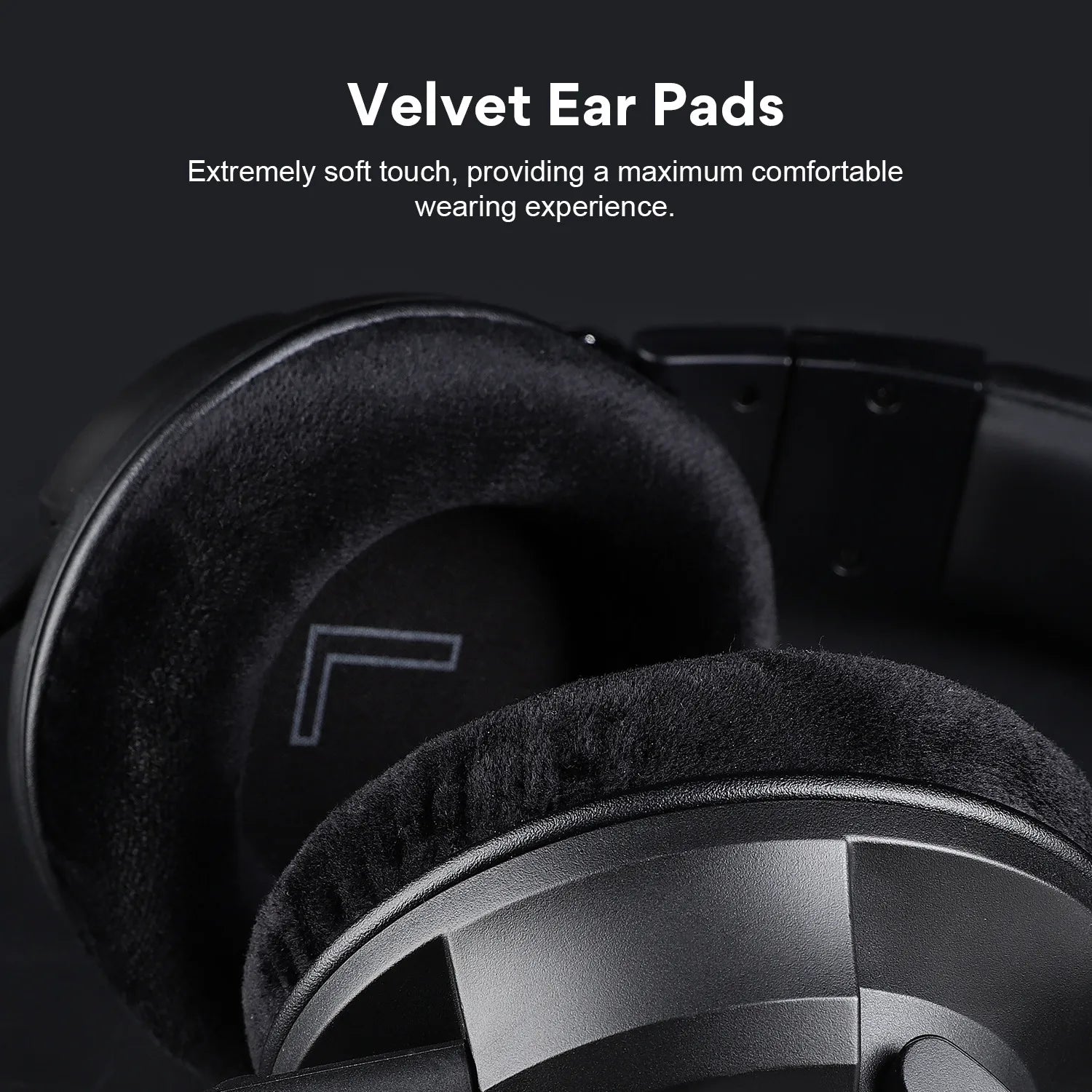 Close-up of headphones with black velvet ear pads, emphasizing their soft texture for comfort. Text above highlights the "Velvet Ear Pads" and their comfortable wearing experience.