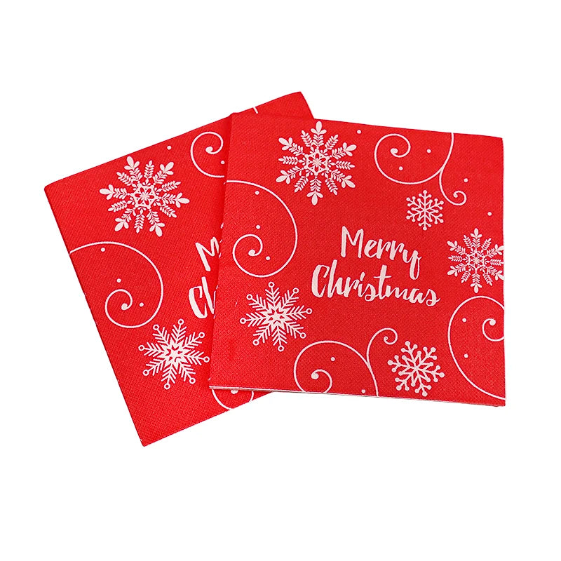 Red Christmas napkins featuring white snowflakes, swirls, and "Merry Christmas" text. The design is festive and cheerful, perfect for holiday celebrations.