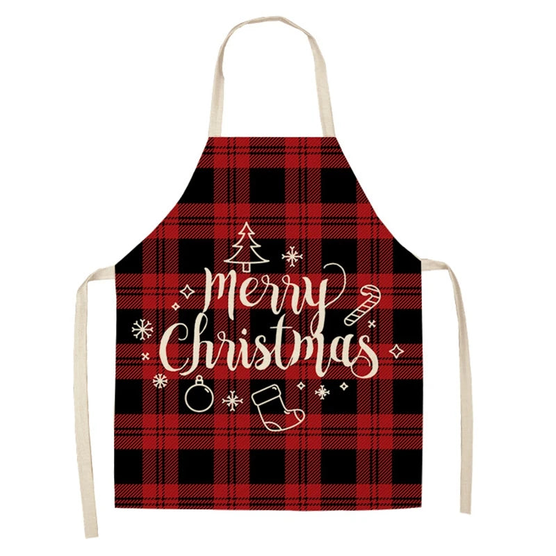 Red and black plaid apron with "Merry Christmas" in white script, featuring festive icons like a tree, candy cane, stocking, ornament, and snowflakes.