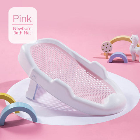 Pink newborn bath net with a mesh design on a pink background. Surrounding toy arches and unicorn add a playful touch. Label reads "Pink Newborn Bath Net."