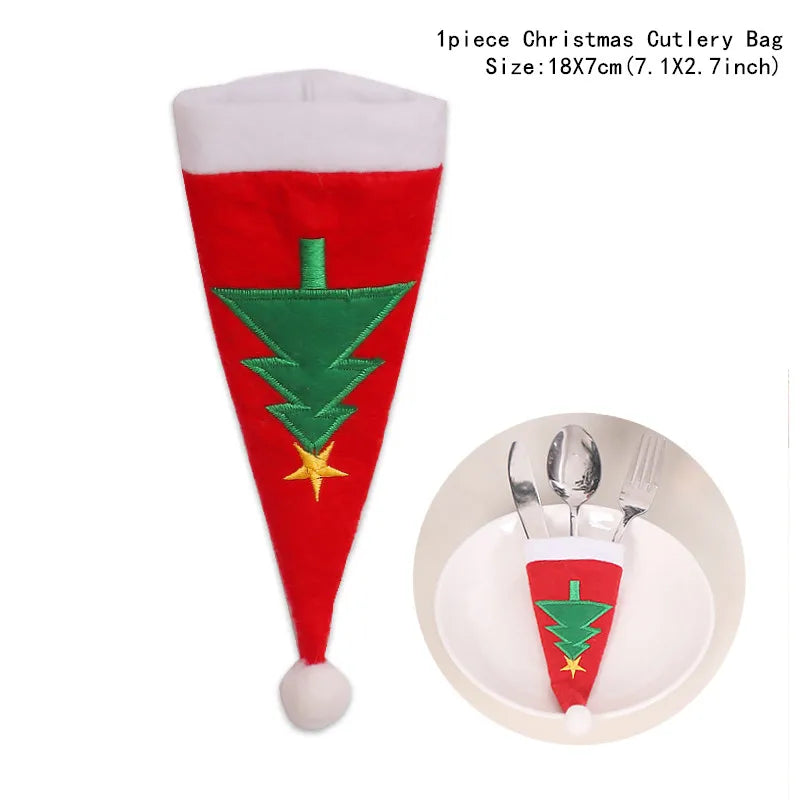 Red and white Santa hat-shaped cutlery bag with green Christmas tree design and yellow star, shown holding utensils in a circular inset image. Size: 18x7 cm.