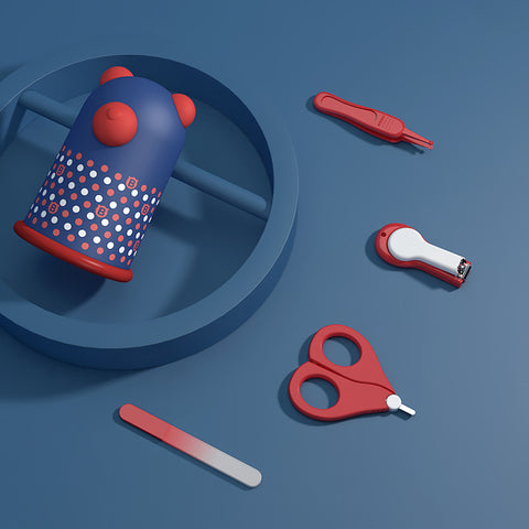 Colorful baby grooming kit with a bear-themed nail trimmer, red scissors, nail clipper, file, and another grooming tool, all placed on a blue circular surface.