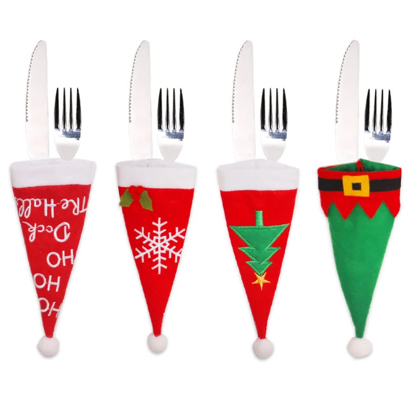 Four festive cutlery holders shaped like Christmas hats, each with unique designs: "Ho Ho Ho", snowflake, Christmas tree, and elf suit, containing a knife and fork.