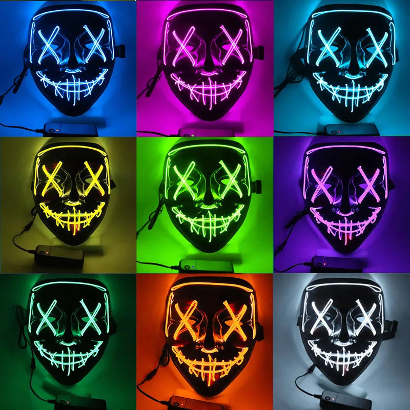 A 3x3 grid of LED masks with stitched smiles and X eyes in various colors: blue, pink, cyan, yellow, green, purple, teal, orange, and white. Each mask is lit and connected to a power source.