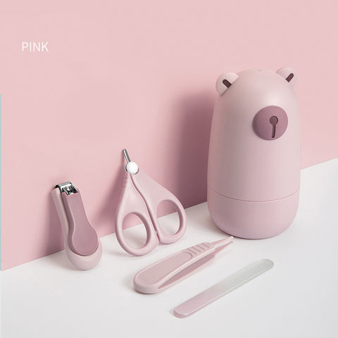 Pink baby grooming set with bear-shaped container, nail clippers, scissors, tweezers, and a glass nail file, set against a soft pink background.