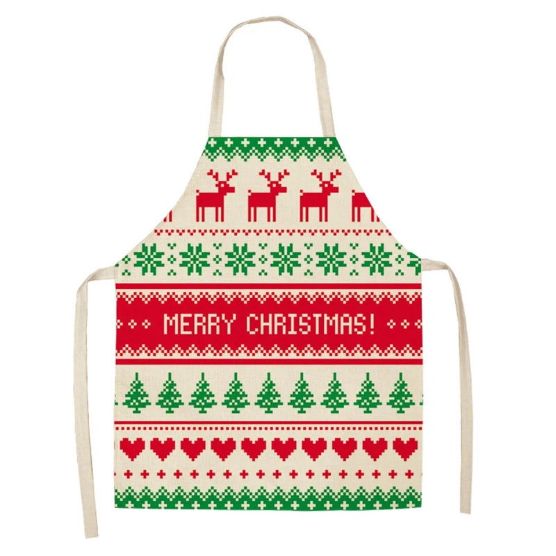 Christmas-themed apron with green snowflakes, reindeer, and trees, red hearts, and "Merry Christmas!" text. Features festive red and green patterns on a beige background.