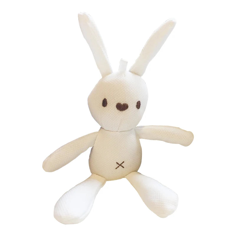 A white, plush rabbit toy with long ears, a simple face, and an "X" stitched on its belly, sitting against a white background.