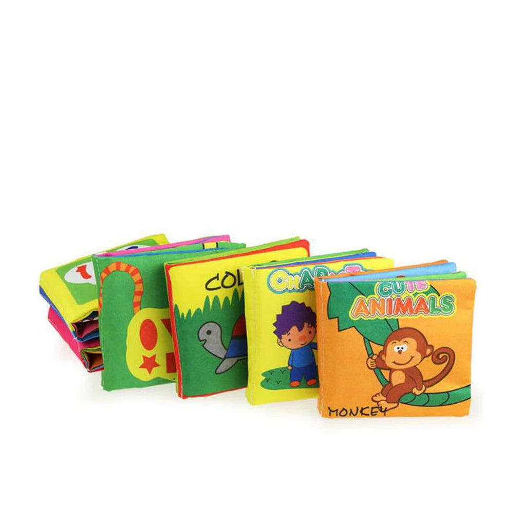 Colorful cloth books for children, featuring cartoon animals and characters. Titles include "Cute Animals" with a monkey, and others with a turtle and a child.