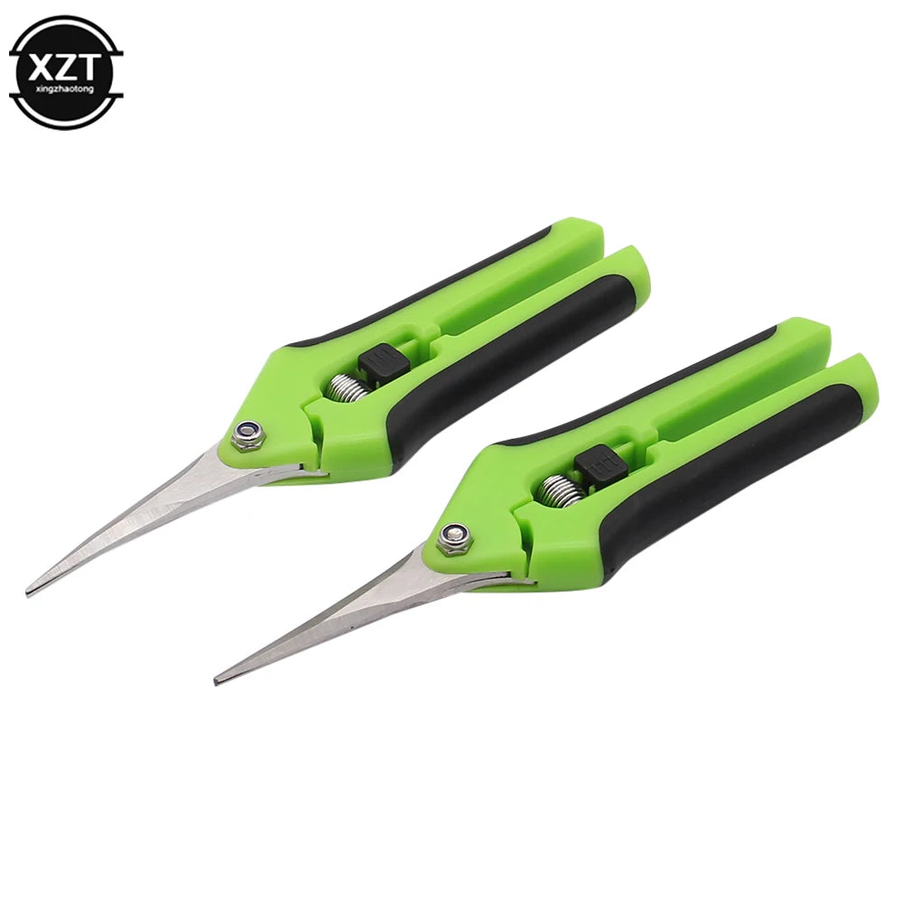 Two green and black pruning shears with sharp, pointed stainless steel blades. Each shear features a safety lock mechanism and ergonomic handles for comfortable grip.