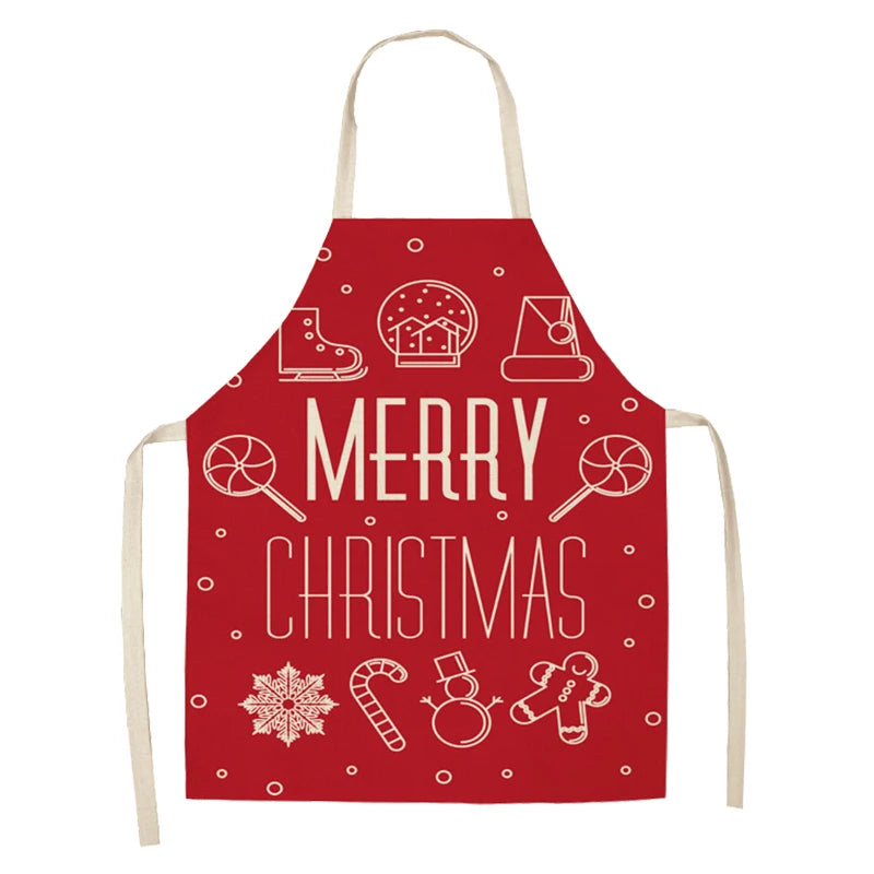 Red apron with white Christmas-themed illustrations including a snow globe, candy cane, gingerbread man, and the text "Merry Christmas."