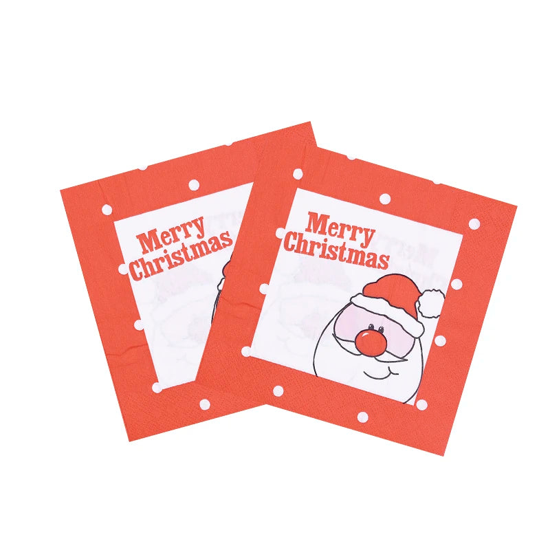 Red Christmas napkins featuring a cartoon Santa with a red nose and hat, white polka dots, and "Merry Christmas" text. Two napkins are slightly overlapping.