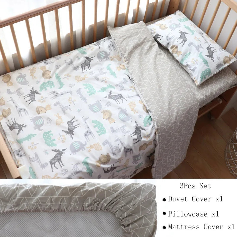 Children's bedding set in a wooden crib, featuring a duvet and pillowcase with woodland animal prints and a geometric-patterned fitted sheet. Includes a 3-piece set list.