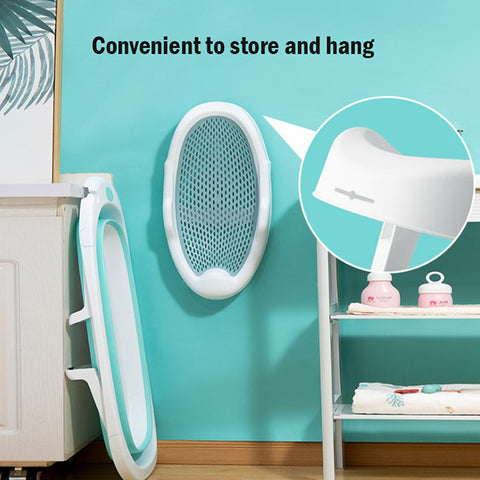 Collapsible bathtub hangs on a turquoise wall, showing its compact and convenient storage design. Inset highlights a close-up of the hanging mechanism.