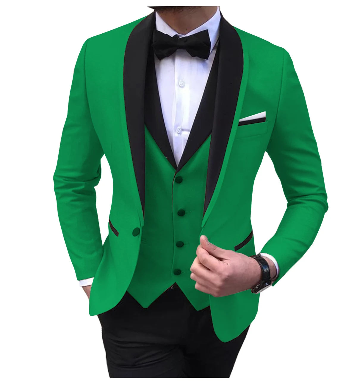 Man wearing a bright green suit with black lapels, a matching green vest, and a black bowtie. He holds the suit jacket with one hand, with a white shirt underneath.